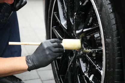 Cleaning alloy wheel spokes with the Sponge Guru round wheel detailer